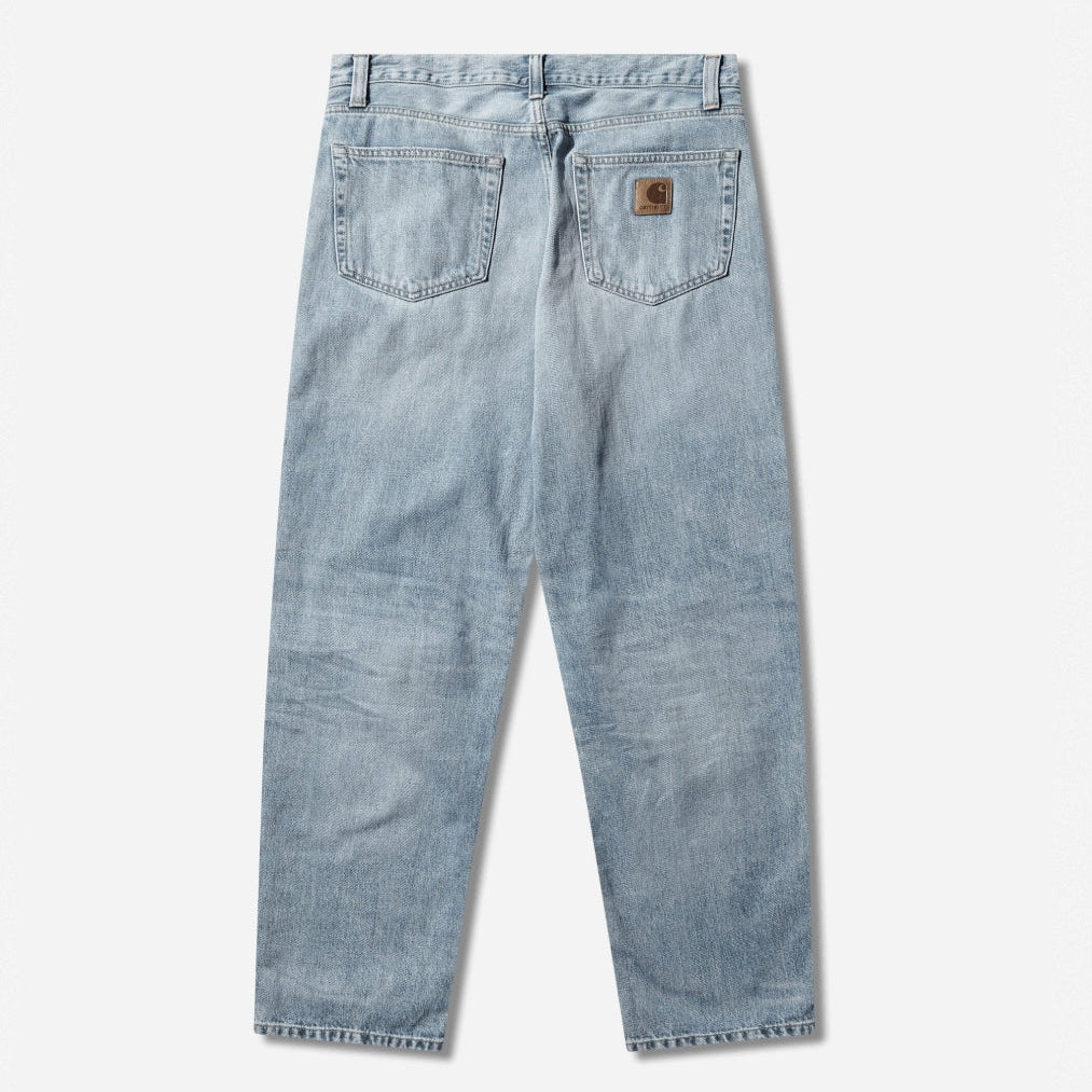 Carhartt WIP Aaron Pants in blue with burst washed finish, casual men's workwear apparel, front view showing fit and fabric details.