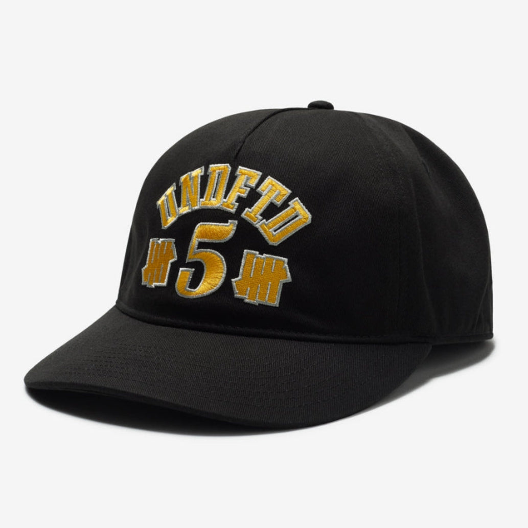 Black UNDEFEATED 5 Logo snapback hat with adjustable strap and embroidered logo on front, stylish headwear for casual wear.
