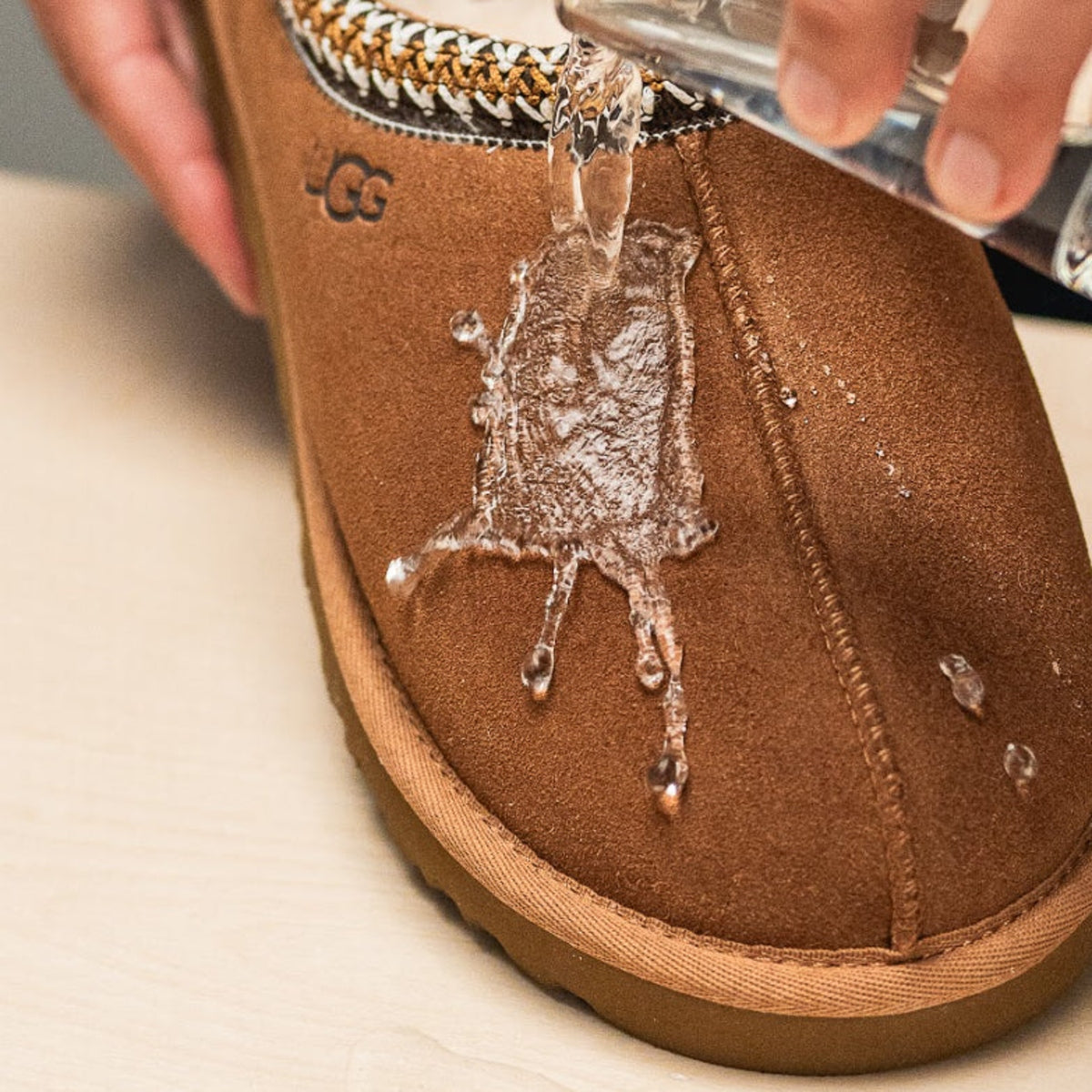 Jason Markk Repel Shoe Spray Refill for shoe care, shown in a square container with a spray nozzle for waterproofing and stain protection.