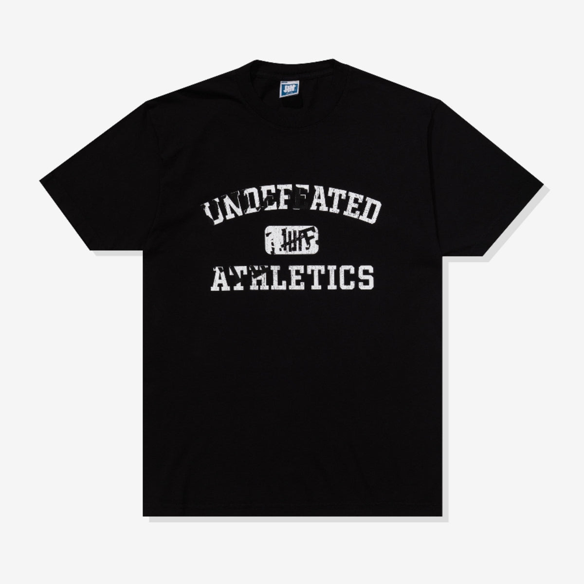 Black Undefeated Misprint T-shirt featuring bold graphic design, made by UNDEFEATED, displayed flat on a white background.