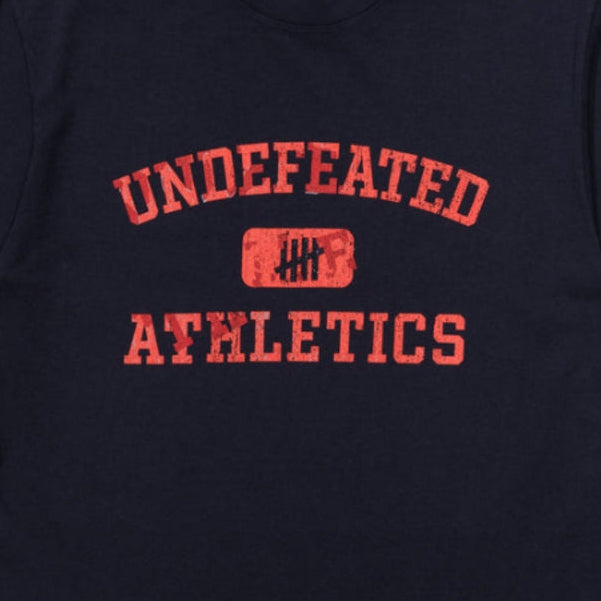 Navy Undefeated Misprint Tee shirt featuring bold graphic print, casual fit, and classic crew neck, designed by UNDEFEATED.
