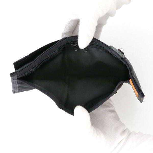 Black Porter Yoshida Japan Tanker Two-Fold Wallet showing folded design, leather texture, and branding details.