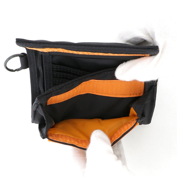 Black Porter Yoshida Japan Tanker two-fold wallet with multiple card slots and compact design, showing the classic accessories style.