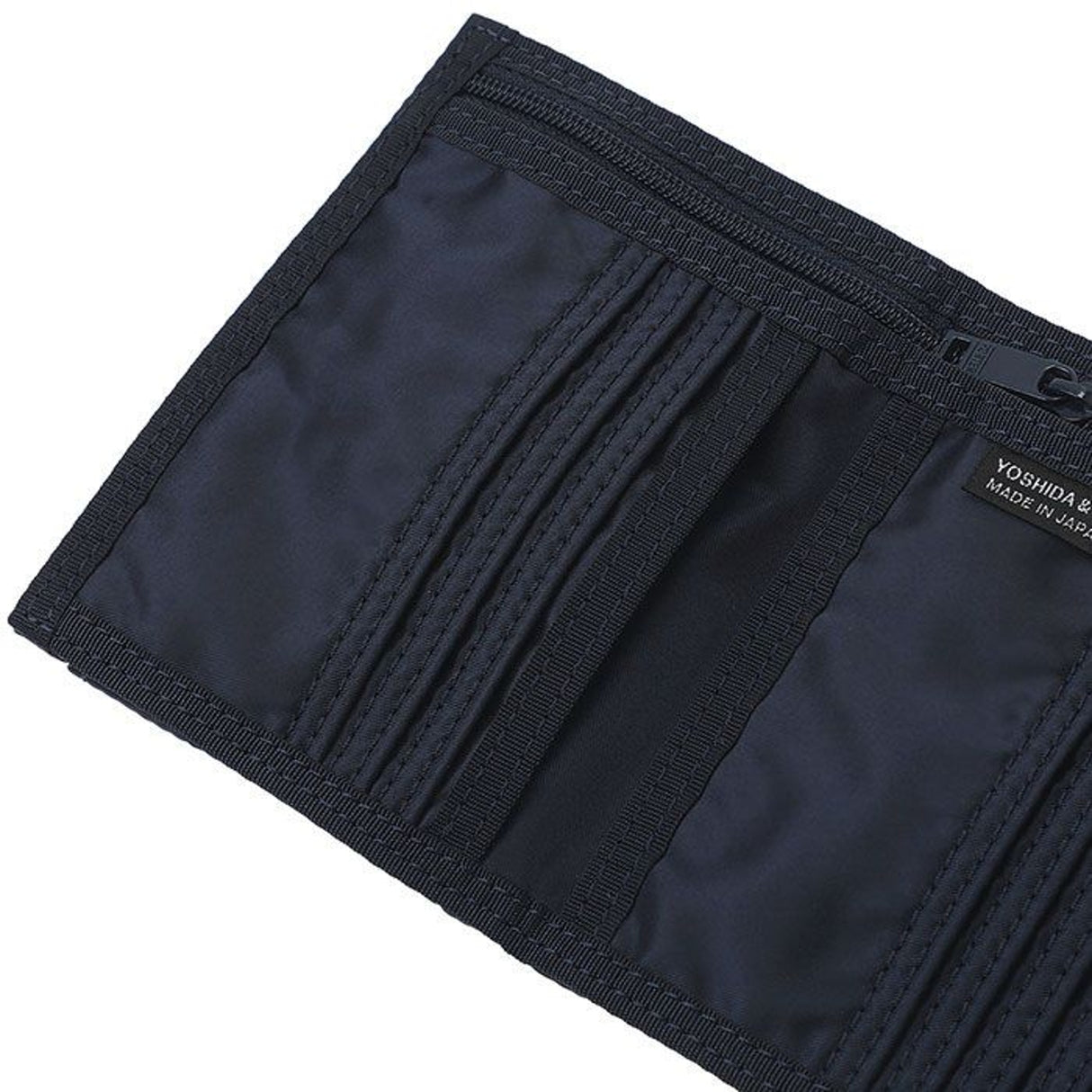 Porter Yoshida Japan Tanker Two-Fold Wallet in iron blue with multiple card slots and bill compartments, made of durable fabric.