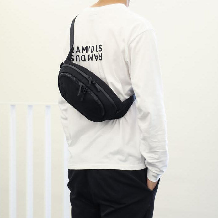 Black Ramidus Tokyo Beauty waist bag from RAMIDUS JAPAN, featuring a sleek design, adjustable strap, and compact storage.