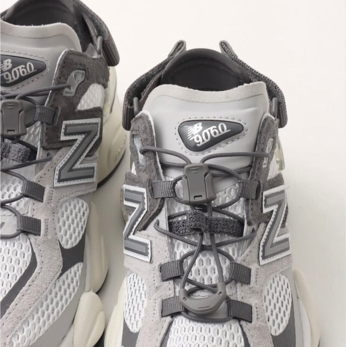 New Balance 9060 Mule Raincloud Castlerock sneakers with gray and white design, showcasing the stylish casual footwear.