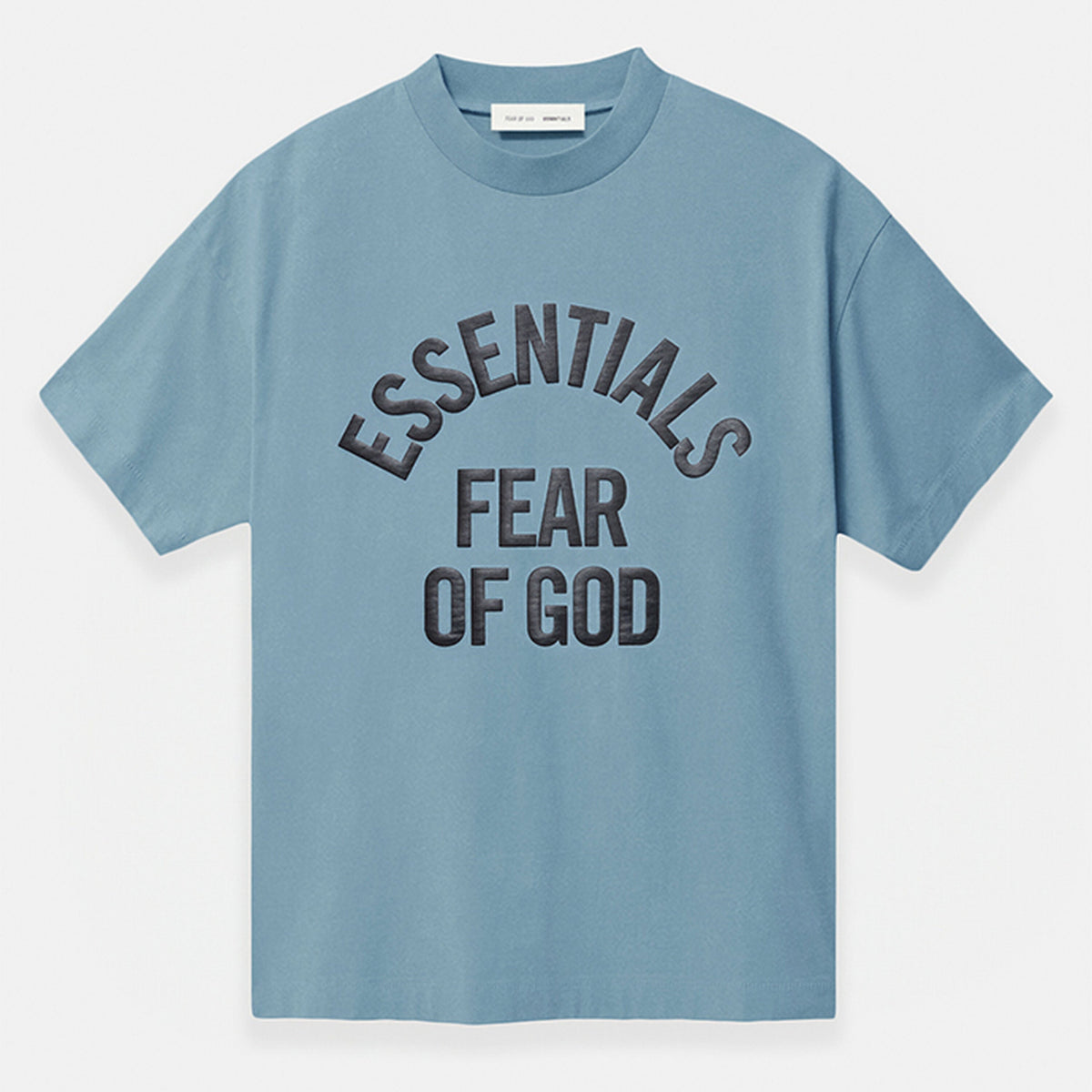 Fear of God Essentials Campus 90s heavyweight tee in faded coastal color, showcasing the relaxed fit and soft cotton fabric.
