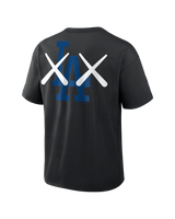 Black KAWS X Nike Los Angeles Dodgers MLB Elevated Max 90 tee for men, featuring graphic design with the HUMAN MADE brand logo.