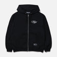 Black Neighborhood Staple Zip Hoodie, casual streetwear with a front zipper and logo details, shown on a model.