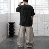 Faded black Stussy Stock Logo Tee shirt with classic graphic design, casual streetwear style, and comfortable fit.