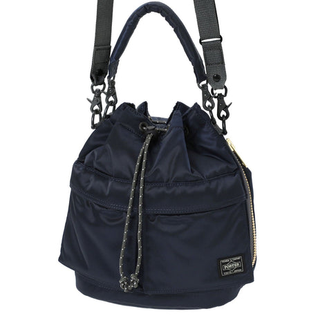Porter Yoshida Japan Tanker 2-Way Tool Bag in navy, durable canvas with leather accents, versatile carrying options.