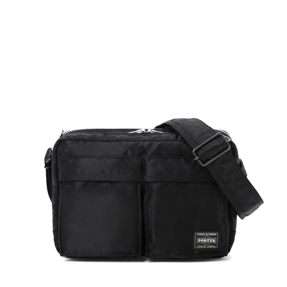 Black Porter Yoshida Japan Tanker Zip Sling Bag with adjustable strap and multiple compartments, stylish and compact for everyday use.