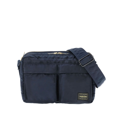 Porter Yoshida Japan Tanker Zip Sling Bag in navy, stylish and compact with adjustable strap and multiple compartments.