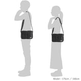 Black Porter Yoshida Japan Tanker Sling Bag with adjustable strap and multiple compartments, made of durable fabric.