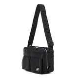 Black Porter Yoshida Japan Tanker Sling Bag with adjustable strap and compact design, made of durable material.