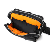 Black Porter Yoshida Japan Tanker Sling Bag with adjustable strap and multiple compartments, stylish and functional for everyday use.