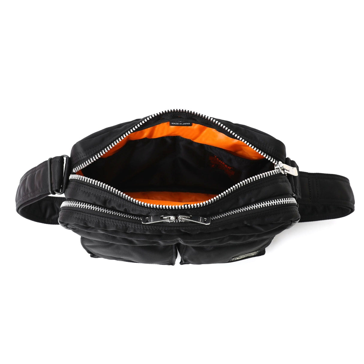 Black Porter Yoshida Japan Tanker Sling Bag with adjustable strap and multiple compartments, casual style for everyday use.