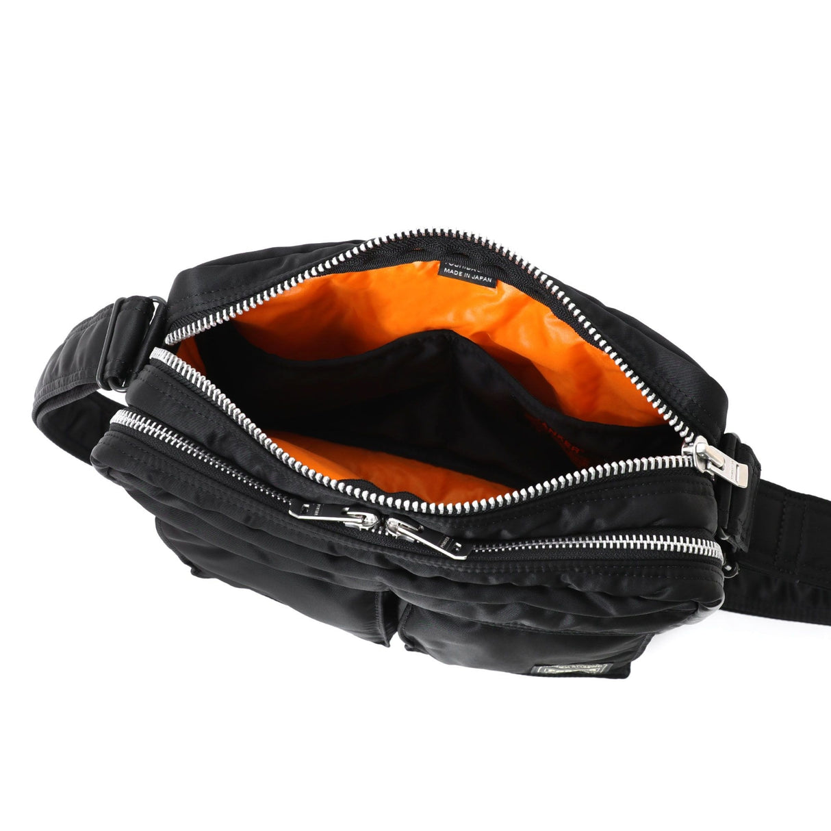 Black Porter Yoshida Japan Tanker Sling Bag with adjustable strap and multiple compartments, durable fabric, and sleek design.