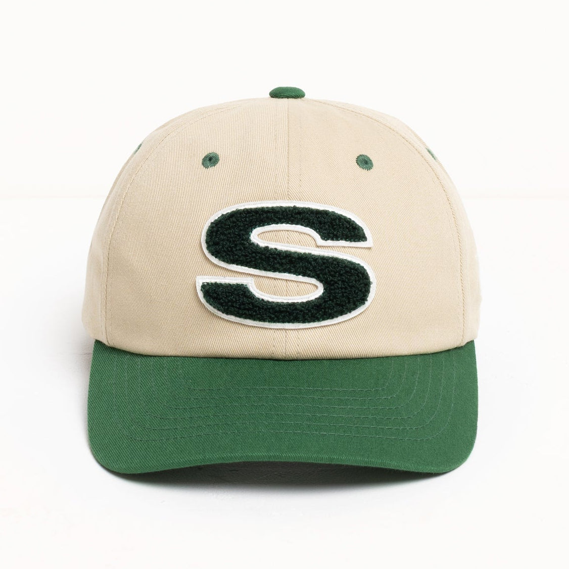 Stussy Chenille S Cap in sand color, casual headwear with embroidered logo, made of soft chenille fabric.