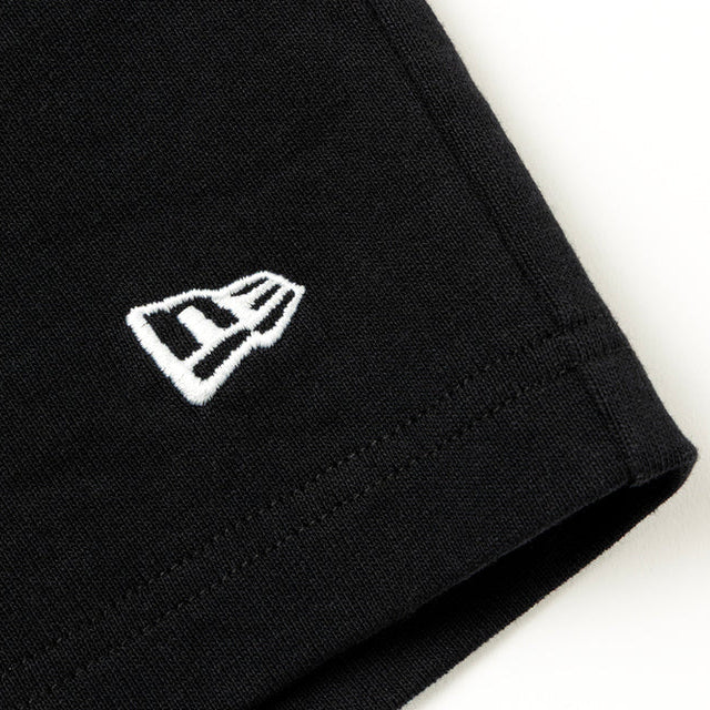 Black Mastermind Japan X New Era Script Logo shorts featuring the brand's logo and stylish design on the fabric.
