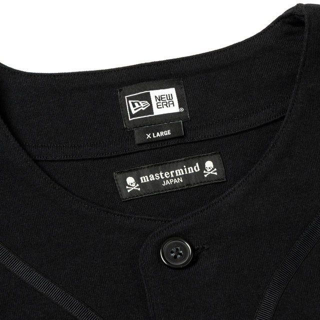 Black heavyweight baseball shirt from Mastermind Japan X New Era, featuring bold branding and classic athletic design.