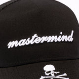 Black Mastermind Japan X New Era trucker cap with logo embroidery, structured front panels, and mesh back for ventilation.