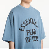 Fear of God Essentials Campus 90s heavyweight faded coastal t-shirt, casual apparel with a relaxed fit and faded coastal color.