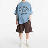 Fear of God Essentials Campus 90s heavyweight faded coastal T-shirt, casual apparel with distressed design and relaxed fit.