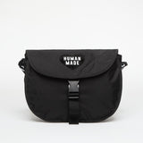 Black Human Made shoulder bag with adjustable strap and spacious interior, showcasing a stylish and functional accessory.