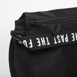 Black Human Made shoulder bag with adjustable strap and minimalist design, made from durable materials.