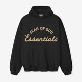 Fear of God Essentials Training 90s Heavyweight Hoodie in faded black, showcasing the cozy, oversized hoodie with brand logo detail.