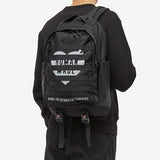 Black Human Made Military Backpack with multiple compartments, adjustable straps, and durable fabric for outdoor and urban use.