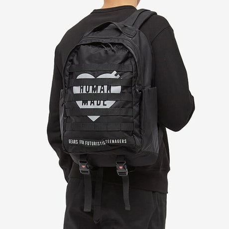 Black Human Made Military Backpack with multiple compartments, adjustable straps, and durable fabric for outdoor and urban use.