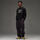 Black UNDEFEATED Undefeated Utility Pant with multiple pockets and relaxed fit, shown on a model.
