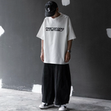 Fear of God Essentials reflective logo ivory ponte 90s tee, casual apparel with upgraded fabric, showcasing the front view.