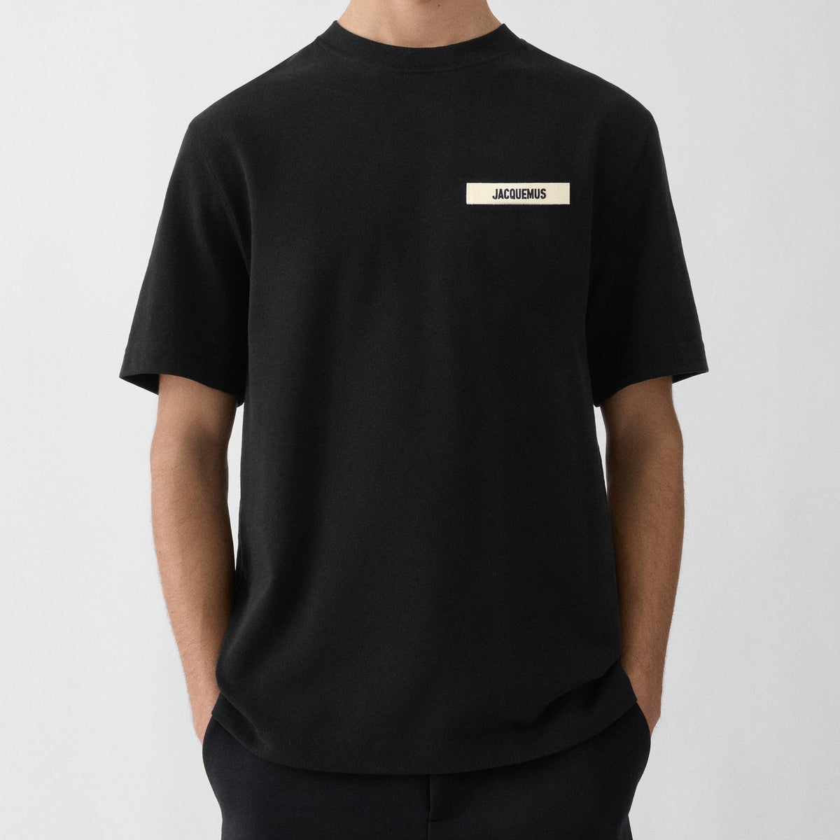 Black Jacquemus Grosgrain Logo Tee from Mastermind Japan with logo detail on the front, casual short-sleeve T-shirt.