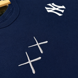 Human Made KAWS x Nike MLB Elevated Max 90 Navy men's tee, featuring graphic design and branding on soft cotton fabric.