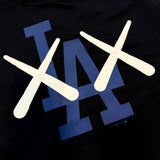 Black KAWS X Nike Los Angeles Dodgers MLB Elevated Max 90 Tee for men, featuring graphic design and casual athletic style.