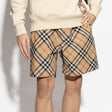 Burberry Diagonal Check shorts in beige and black fabric, featuring the signature check pattern and tailored fit.