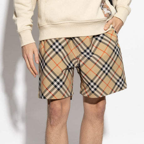 Burberry Diagonal Check shorts in beige and black fabric, featuring the signature check pattern and tailored fit.