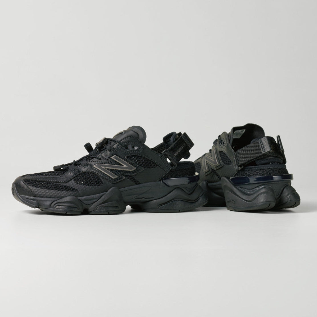 Black New Balance 9060 Mule sneakers with sleek design, showcasing the comfortable slip-on style and modern athletic look.