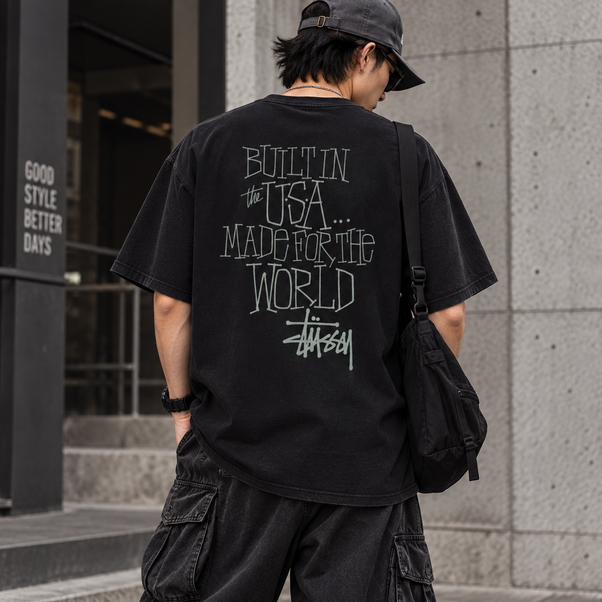 Black Stussy Built In America T-shirt with bold graphic print, casual apparel perfect for streetwear and everyday wear.