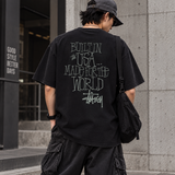 Black Stussy Built In America T-shirt with bold graphic print, casual apparel perfect for streetwear and everyday wear.