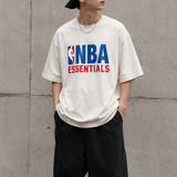 Cream Fear of God Essentials NBA 90s Heavyweight Tee, casual men's apparel with bold graphic design and comfortable fit.