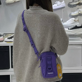 Supreme purple box logo sling bag with adjustable strap and compact design, ideal for casual carry and streetwear style.