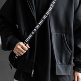 Human Made black military mini sling bag with adjustable strap and compact design, ideal for casual and outdoor use.