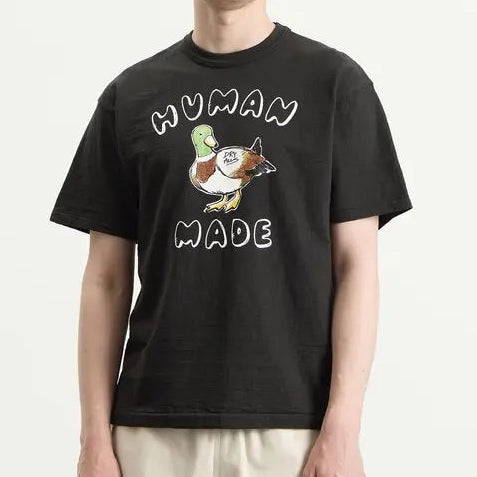 Black Human Made Graphic Duck T-shirt featuring a colorful duck illustration on the front. Classic casual apparel.