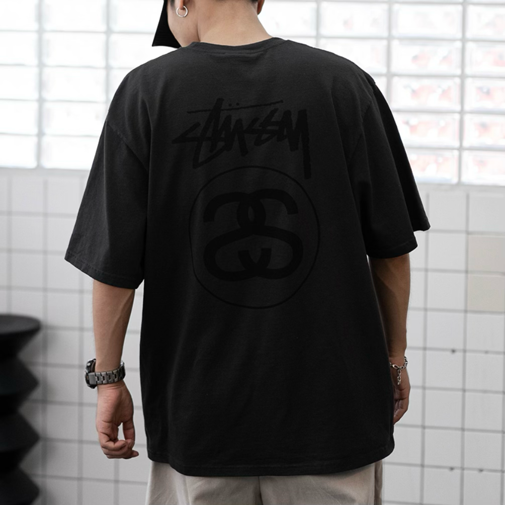 Stussy Stock Logo Tee in faded black, casual apparel with the iconic Stussy logo on the front.