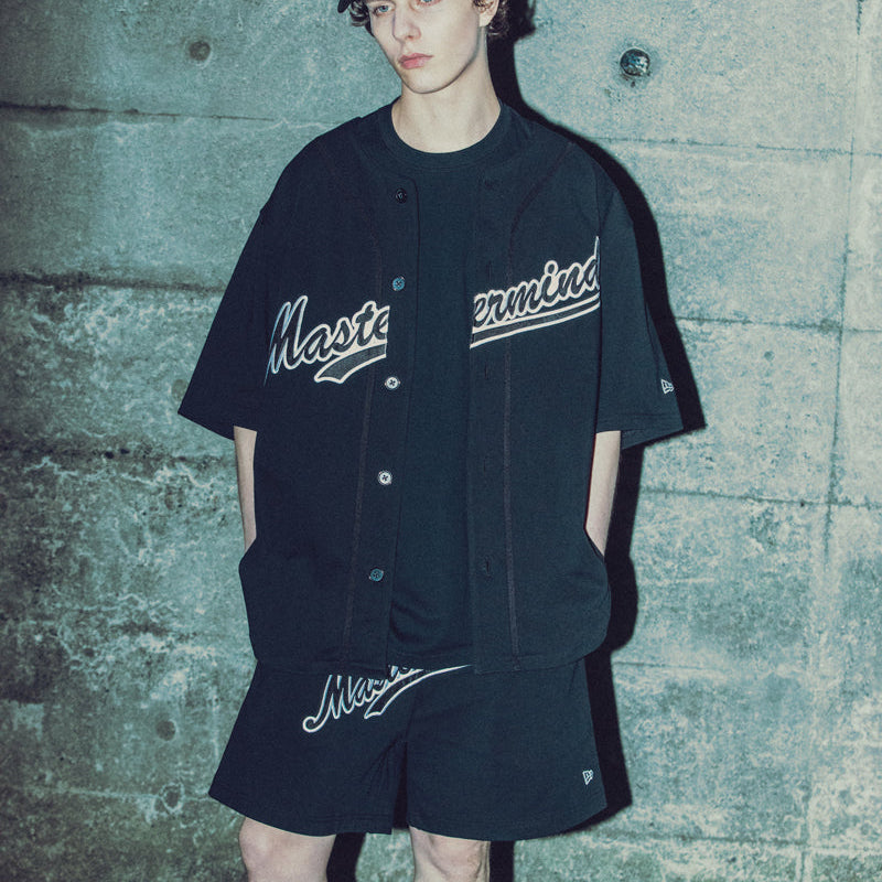 Black Mastermind Japan X New Era script logo shorts with branding details and casual fit, designed for streetwear and fashion.