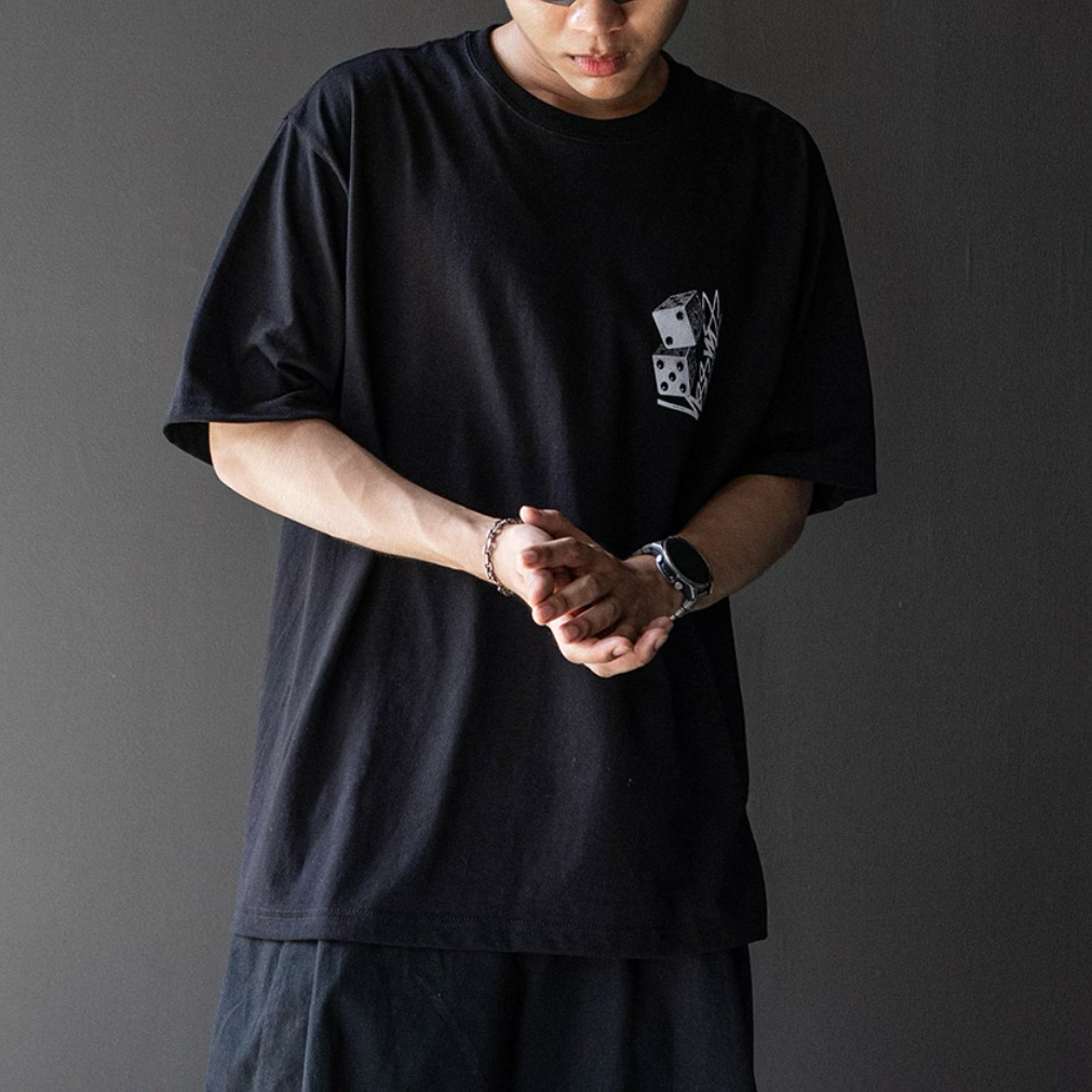 Black Stussy Tall Dice Tee shirt with bold dice graphic on the front, casual streetwear apparel by Stussy.